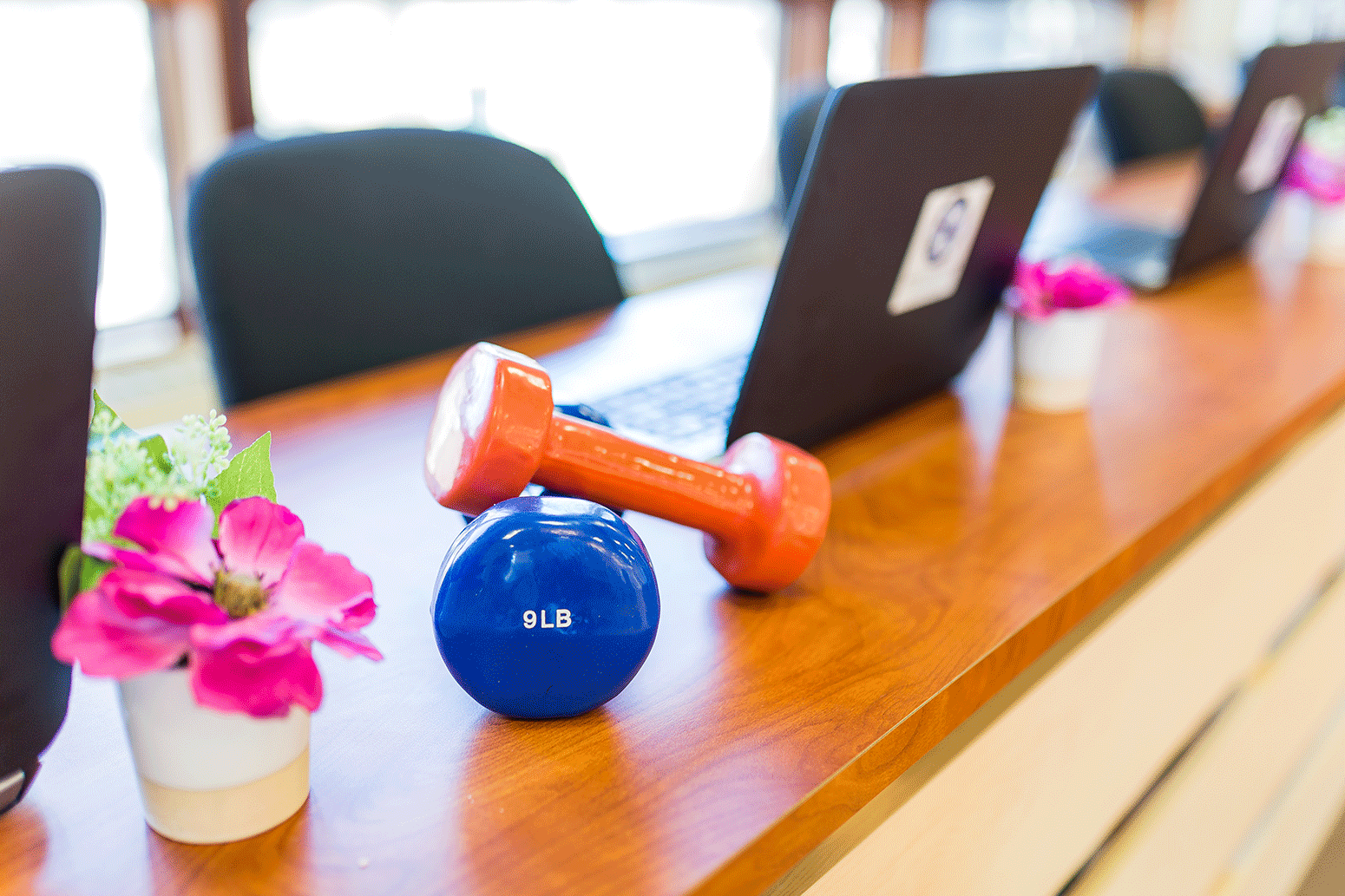 hand weights resting on a desk