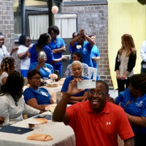 Joel Landau Surprises Harlem Center Staffers with Bonuses